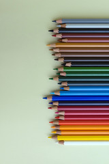 Fototapeta premium Color pencils on green background