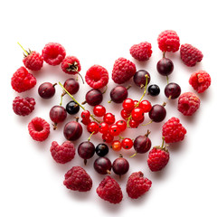 Heart made of different fresh berries. Symbol of love for healthy raw vegan food concept