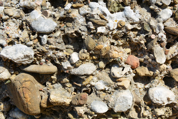 Masonry stone wall in the ancient city of side in Turkey. Natural stone background