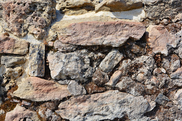 Masonry stone wall in the ancient city of side in Turkey. Natural stone background