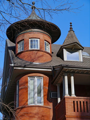 large old brick house with round turret room © Spiroview Inc.