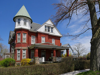 large old brick house with turret room and gable