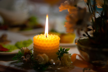 one candle is burning on the table