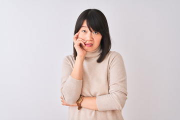 Young beautiful chinese woman wearing turtleneck sweater over isolated white background thinking looking tired and bored with depression problems with crossed arms.