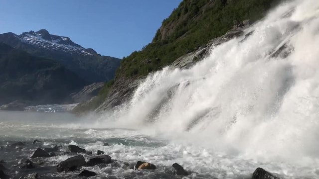 Panning up from bottom of Nugget Falls in Juneau