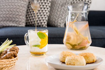 Herbal ginger and lemon grass tea served with mint, honey and a slice of orange.