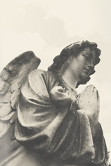Holy angel Christianity religious symbol. Guardian angel with wings antique statue. Symbol of...