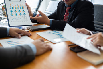 Hand businessman team is analyzing the cost of housing projects to live with lifestyle.business concept, soft focus, vintage tone