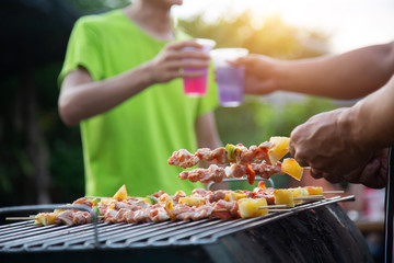 Barbeque Grill Street Food in thailand,Eat outdoors in a happy family. holiday celebration concept