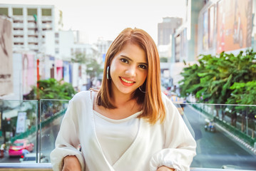 Fototapeta premium Close-up beautiful woman smile portrait at walking street in the city.