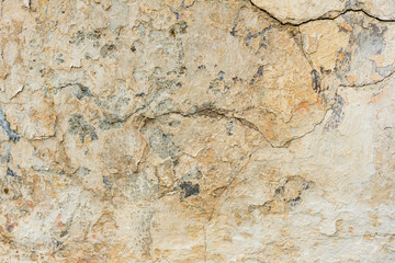 Texture of a concrete wall with cracks and scratches which can be used as a background