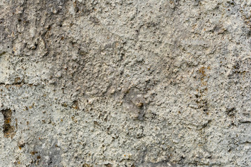 Texture of a concrete wall with cracks and scratches which can be used as a background