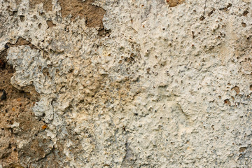 Texture of a concrete wall with cracks and scratches which can be used as a background