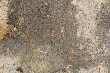 Texture of a concrete wall with cracks and scratches which can be used as a background