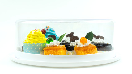 Many cakes in a white tray on white background, Closeup Front view Food concept.