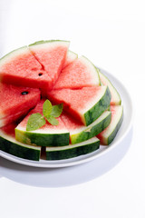 Slices of fresh watermelon on white marble background