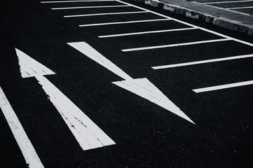 2 Ways two directions arrows paint on asphalt road. Conflicts Confusion concept.