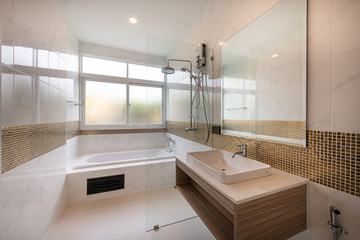 Interior of Modern bathtub bathroom and sink interior in a hotel.
