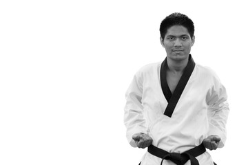 Fototapeta na wymiar Black belt Taekwondo man isolated on white background with clipping path