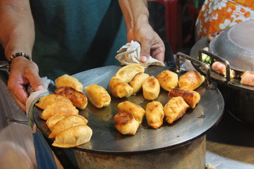 Thai street food on the streets in Bangkok in the evening people come to buy food. delicious food in Asia. Night market.