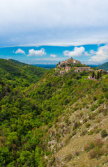 Obraz premium Cottanello (Rieti, Italy) - A very small and charming medieval village with stone hermitage on the Rieti hills, Sabina area, Lazio region, central Italy.