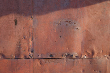 Old rusted metal texture. The surface of an uneven iron wall. Perfect for background and grunge design.