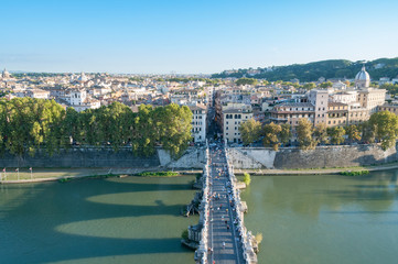 Fototapeta premium Castle of the Holy Angel bridge with people and Rome historic centre