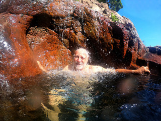 Senior man having fun at Wangi Falls Northern Territory of Australia