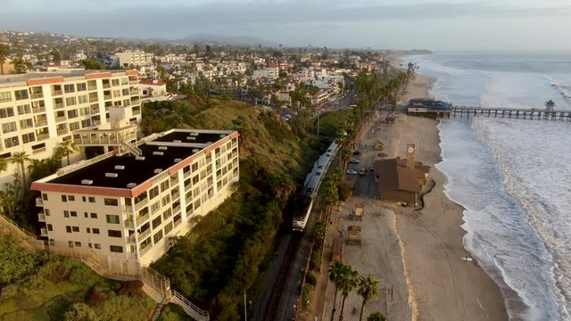 Aerial view of San Clemente Pier with beach and coastline before sunset time . San Clemente city in Orange County, California, USA.