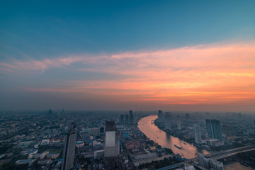 Fototapeta premium Aerial view of Bangkok at sunset with beautiful sky