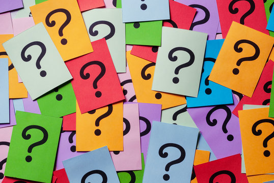 Background texture of multicolored question marks