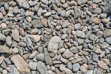 Grey stones with smooth texture. Abstract art pattern background. Ocean coast, backdrop wallpaper. Sea pebbles decoration.