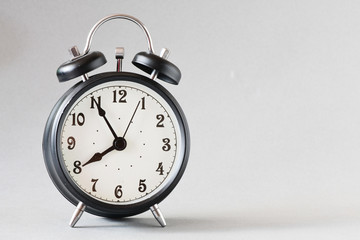 Black old style alarm clock 