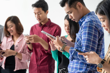 best friend holding handphone a cell phone individually