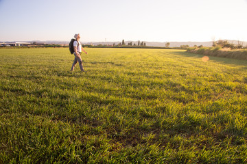 backpacker traveler walking at sunrise