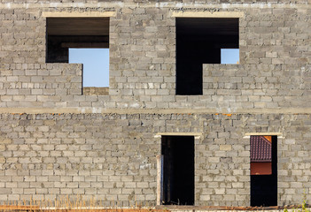 Doors and windows in a cinder block house under construction