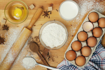 Fototapeta na wymiar Food ingredients for baking: flour, eggs, milk, sugar