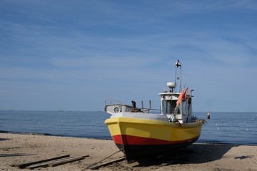 Wooden fishing boat on the beach of Baltic Sea in Sopot/Poland in sunny summer day. 