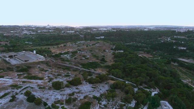 Aerial View Of The Buskette Gardens Fields Near The Verdala Palace,Siggiewi, Malta drone dolly in shot