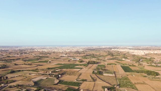 Aerial view of agricultural fields near buskette gardens. drone dolly in shot