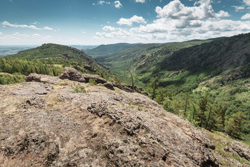 Landscape with low mountains covered with forest in the wildlife reserve