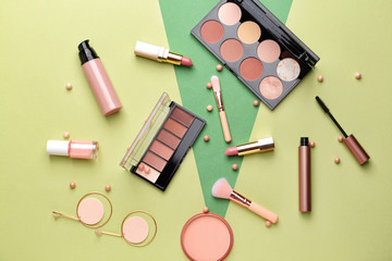 Set of makeup cosmetics on color background