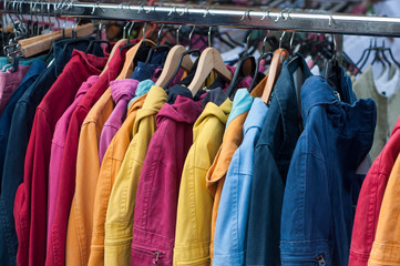 Obraz premium closeup of fishing vests collection on hanger at the market