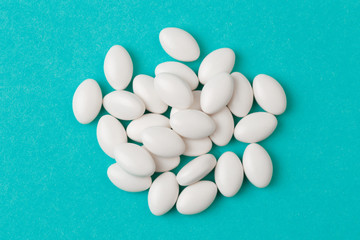 white  tablets on blue  background - Image .