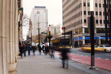 Busy city street with blurred people