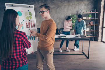 Portrait of focused concentrated millennial have briefing lady checked shirt red yellow pullover sweater trousers start-up glasses spectacles loft industrial interior stand