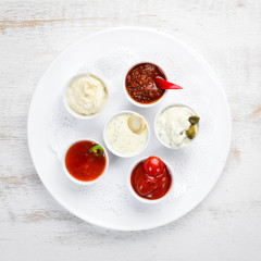 A set of barbecue sauces. Top view. Free space for your text.
