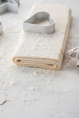 Fresh raw dough on table. Puff pastry. Copy space.