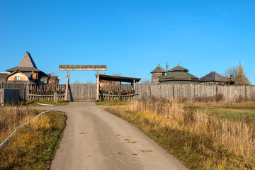 The road to the entrance gate and the wooden wall of the Slavic Kremlin