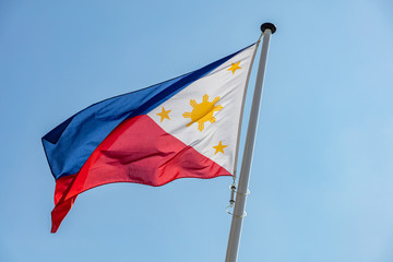 Philippines flag waving against clear blue sky